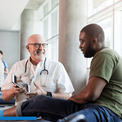 Veteran in consultation with doctor at VA hospital 