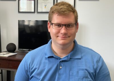 A young man standing confidently after purchasing individual marketplace insurance with MLD, ensuring his health and budget needs are met.